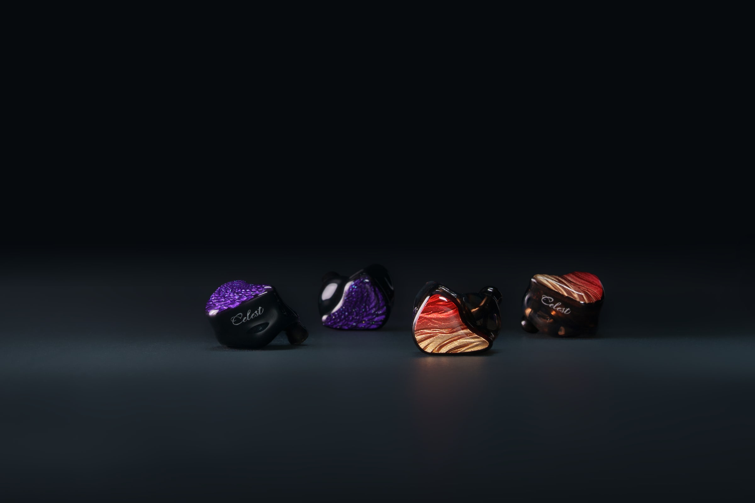 Four Celest in-ear monitor designs arranged in a studio line-up