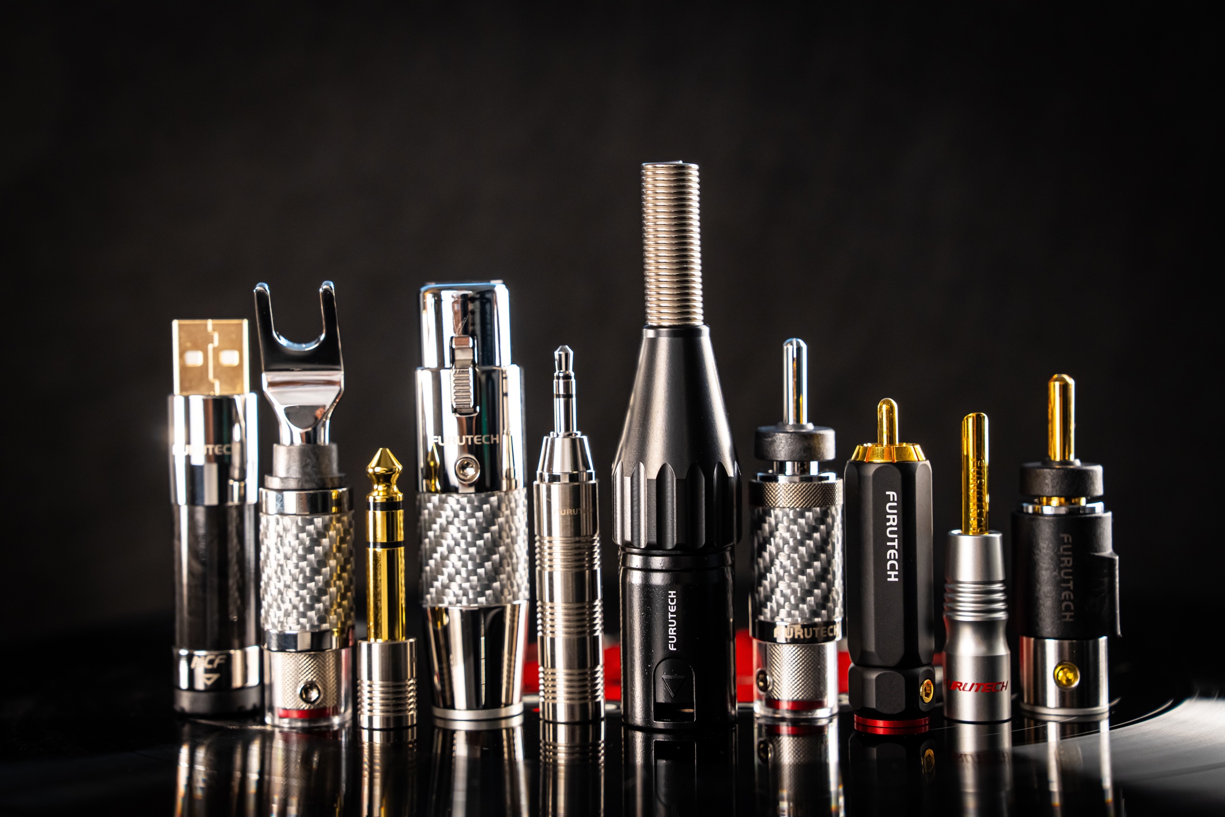 Furutech connector range photographed against a black studio background