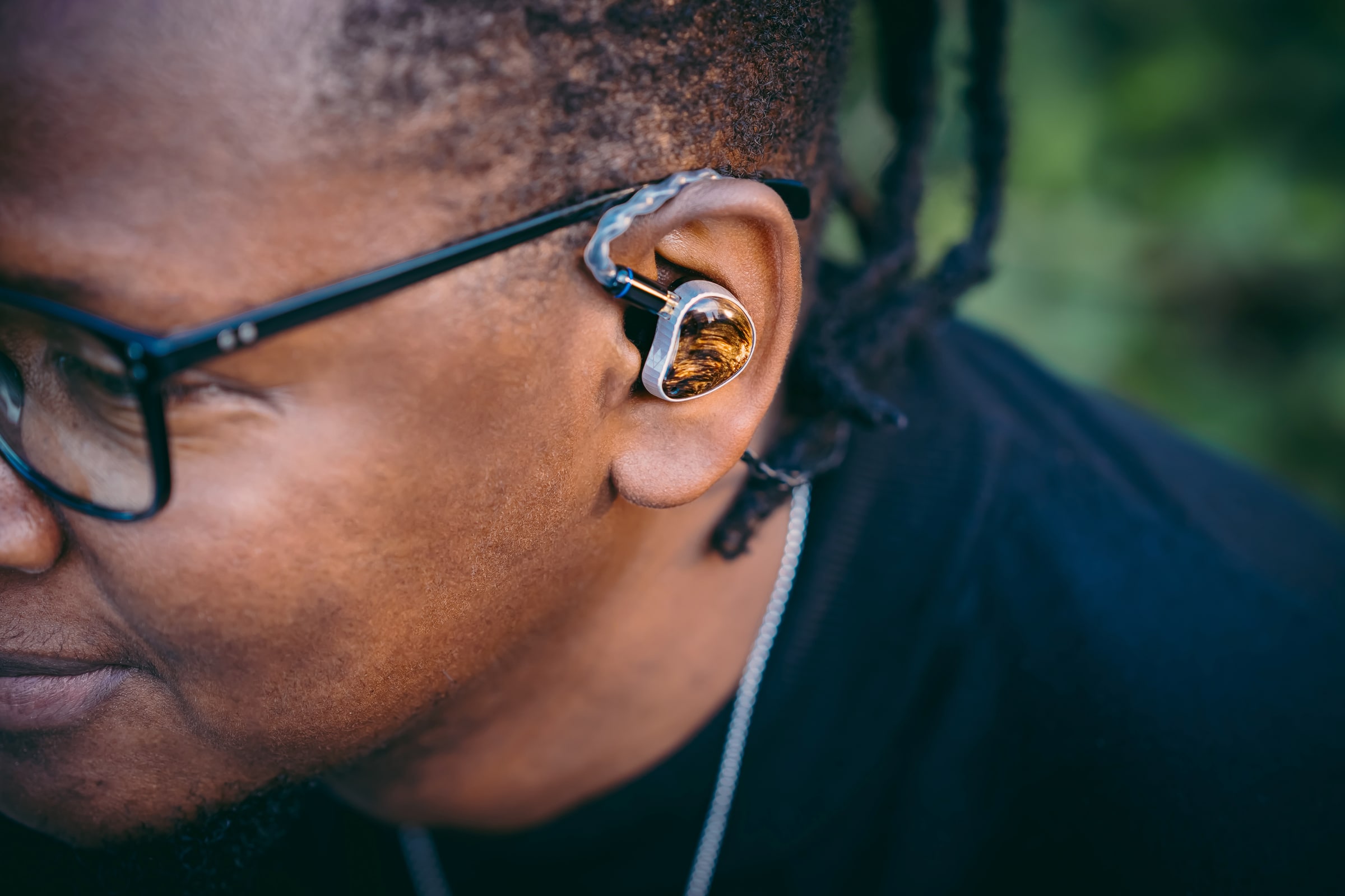 Noble Audio in-ear monitor shown in use